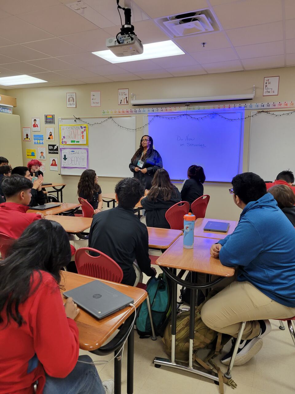 Hedreich working with students in a classroom