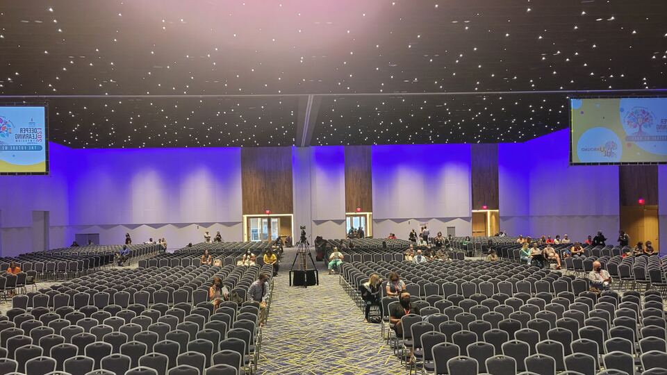 A large conference hall set for a keynote